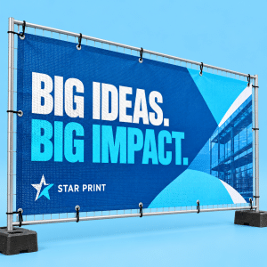Mesh banner with blue and white artwork and visible perforations on a light blue background